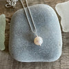 Simple Pearl on a Shimmering Silver Chain